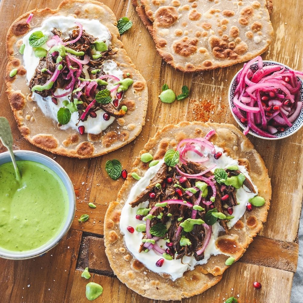 Slow cooked Moorish style goat shoulder on flatbread