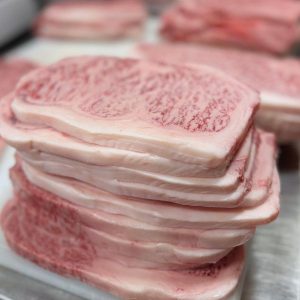 Stacked thin-cut Kagoshima A5 Japanese Wagyu sirloin steaks