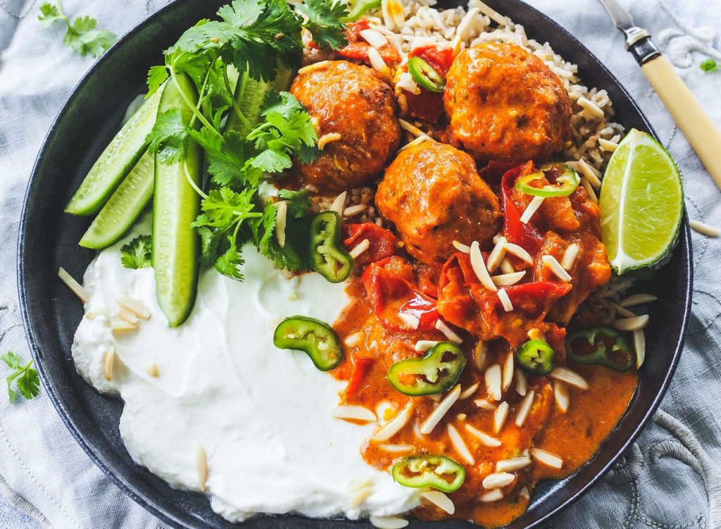 with Rustic Tomato Garam Masala Sauce and Slivered Almonds with yoghurt