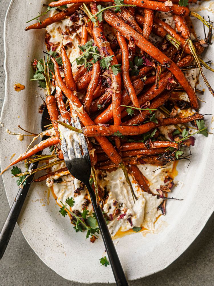 HARISSA AND MAPLE-ROASTED CARROT SALAD WITH GARLICKY CASHEW CREAM ON SERVING PLATTER