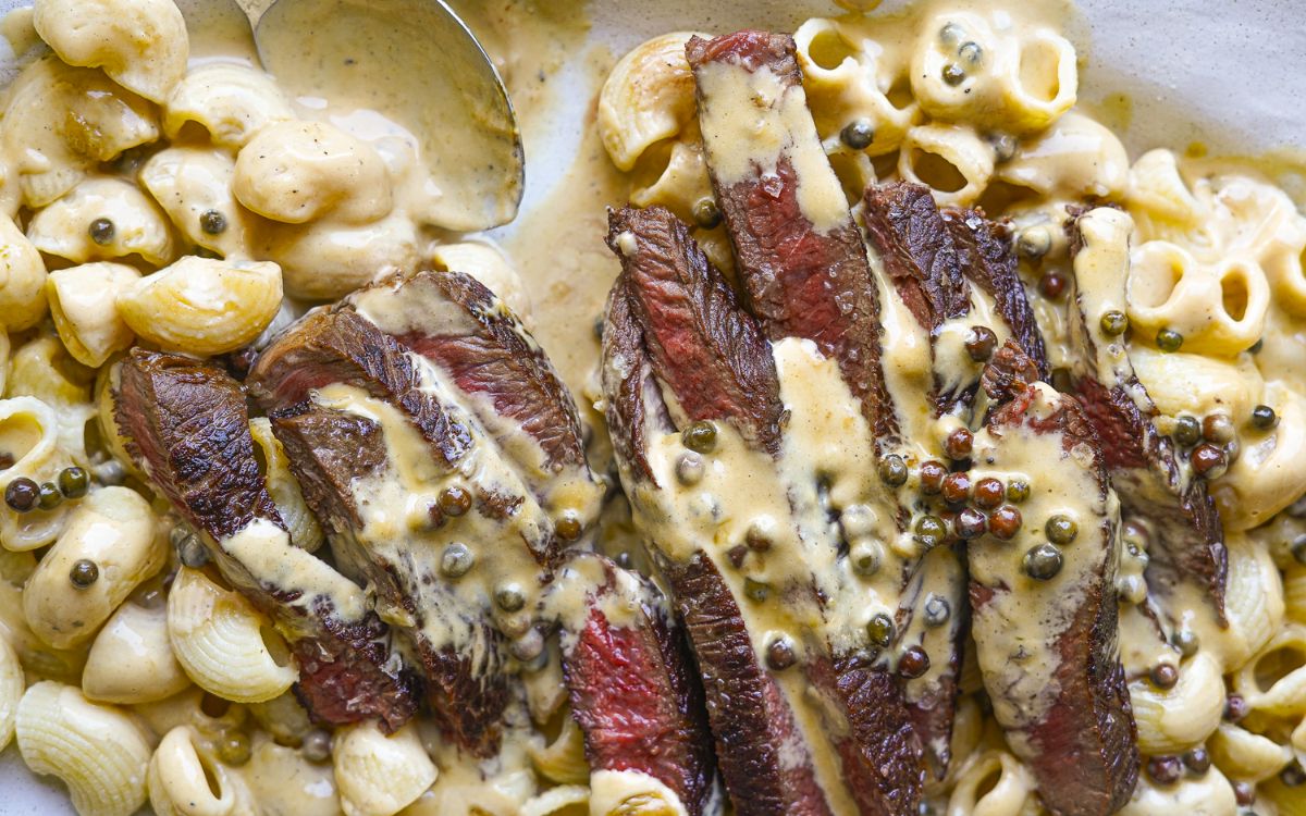 WAGYU RUMP & PEPPERCORN SAUCE PASTA on a serving platter
