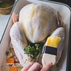 A whole turkey being basted