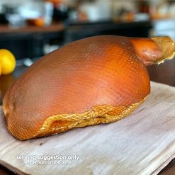 WHOLE Ham on the bone ON chopping board